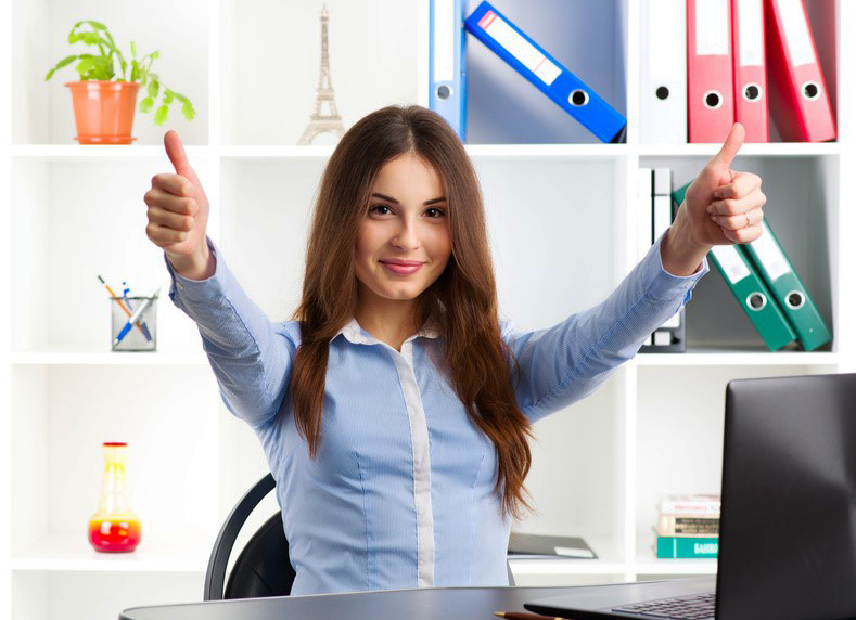 Happy woman at desk