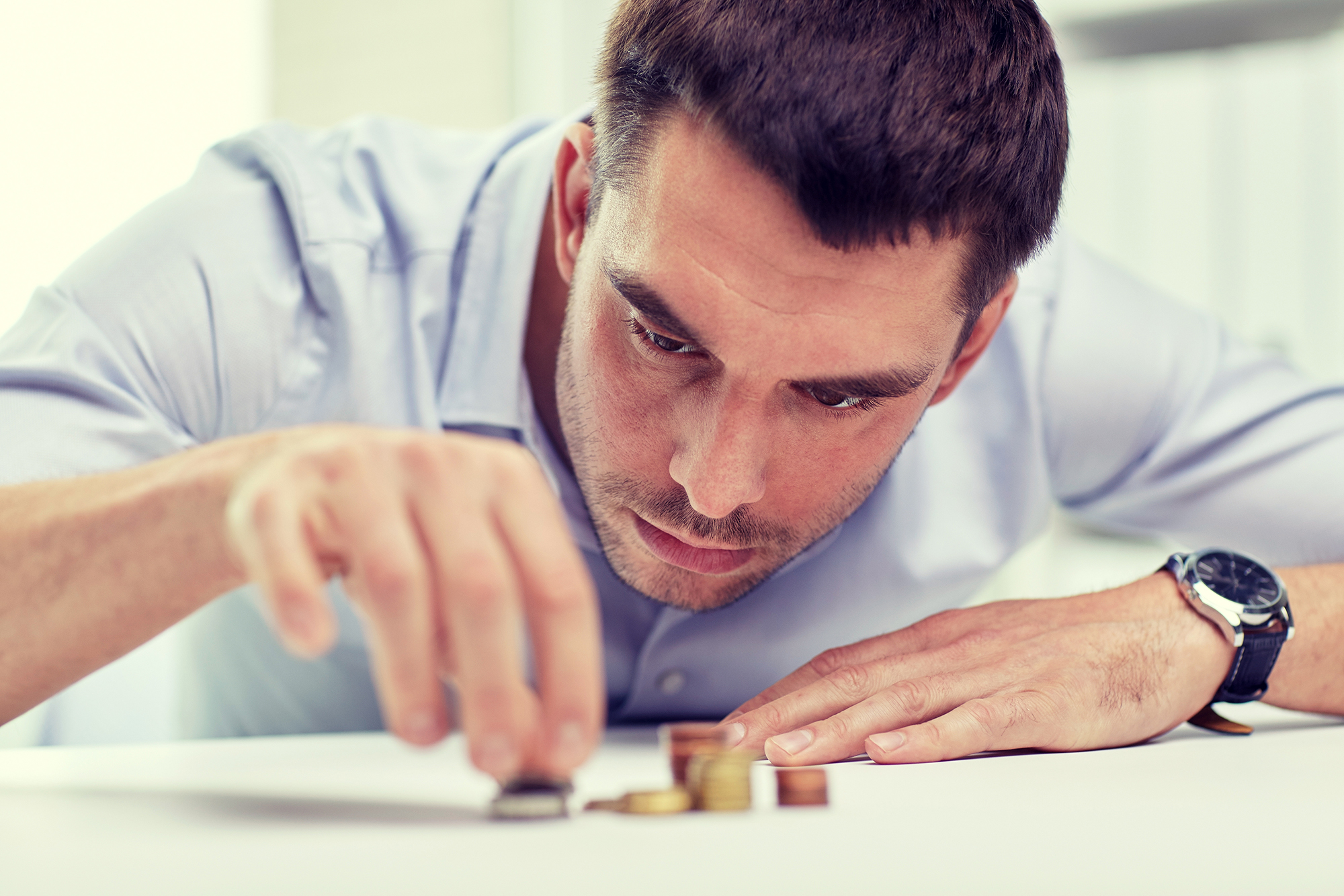 Man Counting Coins