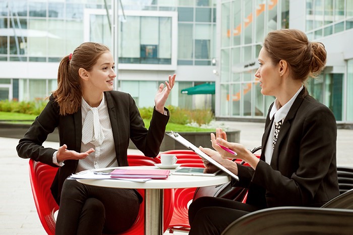 Woman interviewing a millennial 