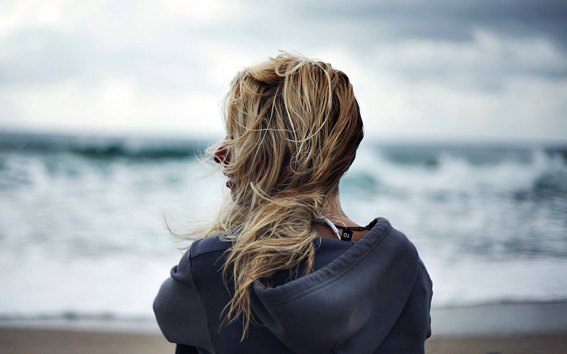 Woman standing near ocean