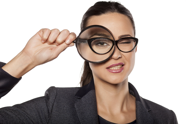 Woman with magnifying glass